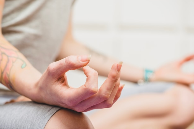 Hands of meditating woman