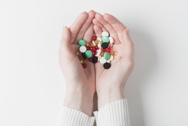 Free Photo hands of patient with pills