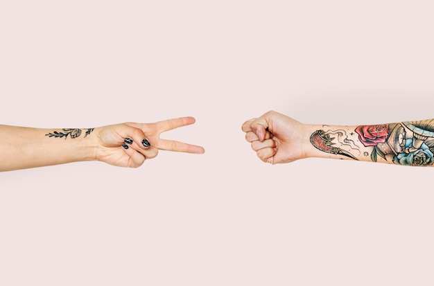 Hands playing rock-paper-scissors