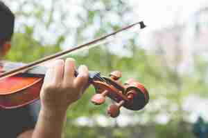 Free photo hands playing the violin