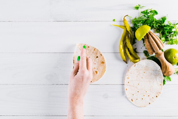 Hands preparing tasty mexican food