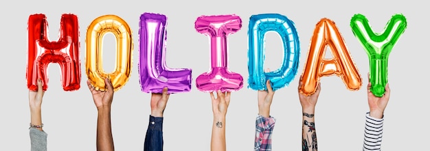 Free photo hands showing holiday balloons word