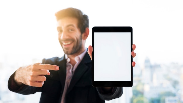 Free photo hands showing a tablet with blank screen