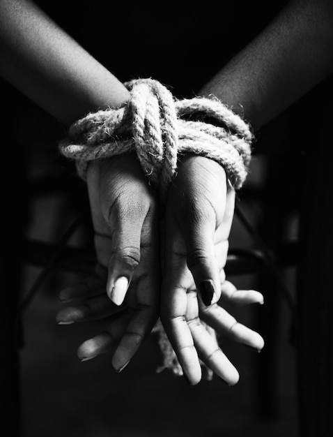 Free photo hands tied with rope around