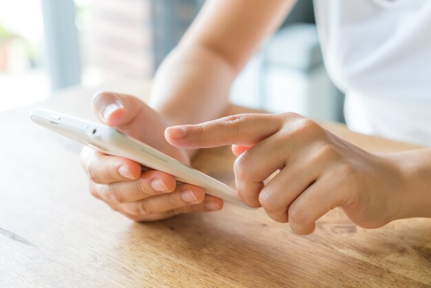 Hands touching a smartphone