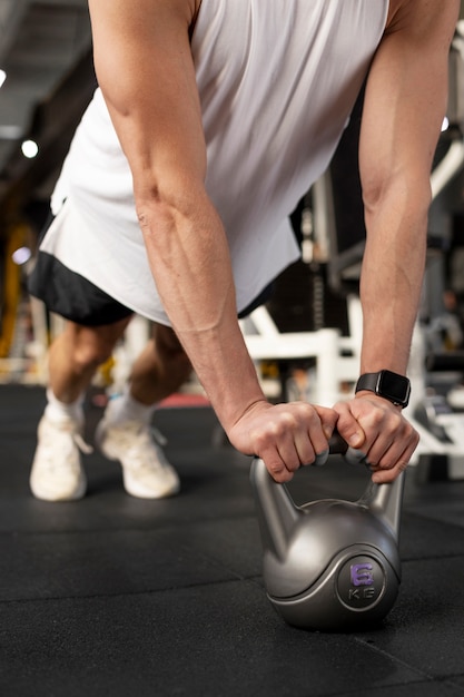 Free Photo hands training with kettlebell close up