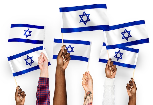 Free photo hands waving flags of israel