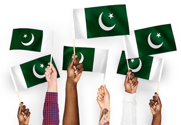 Free photo hands waving flags of pakistan