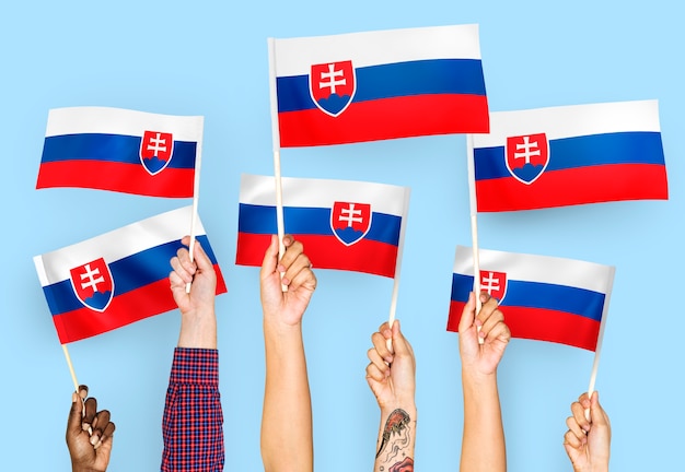 Hands waving flags of Slovakia