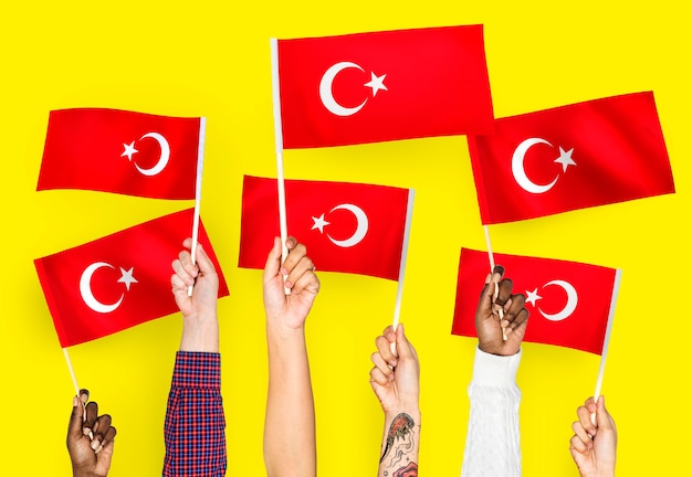 Free Photo hands waving flags of turkey