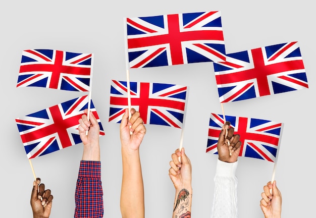 Free Photo hands waving the union jack