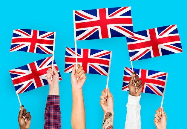 Free Photo hands waving the union jack