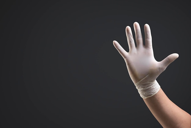 Free photo hands wearing medical gloves using invisible screen