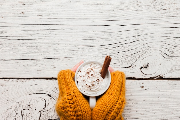 Hands with coffee cup and copy-space