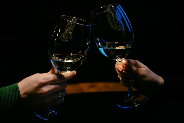 Hands with glasses of champagne. Family couple. Close-up.