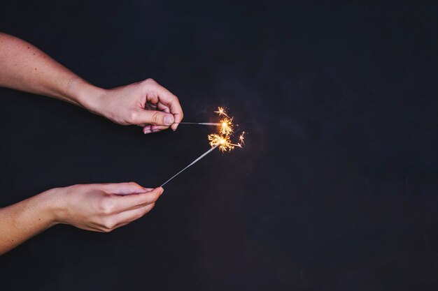 Free Photo hands with sparklers