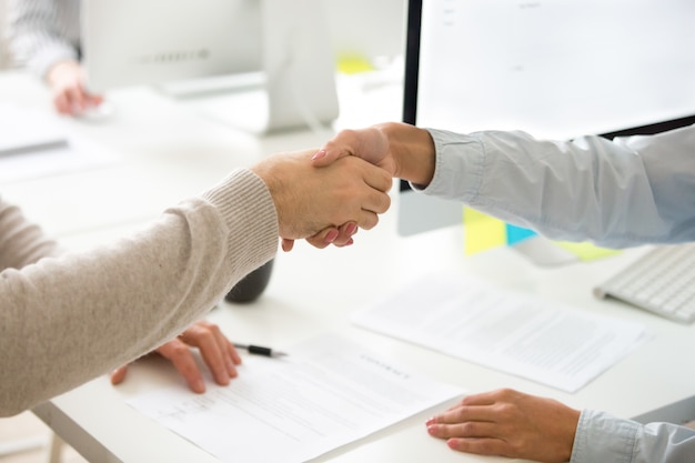 Free Photo handshake of man and woman after signing business contract, closeup