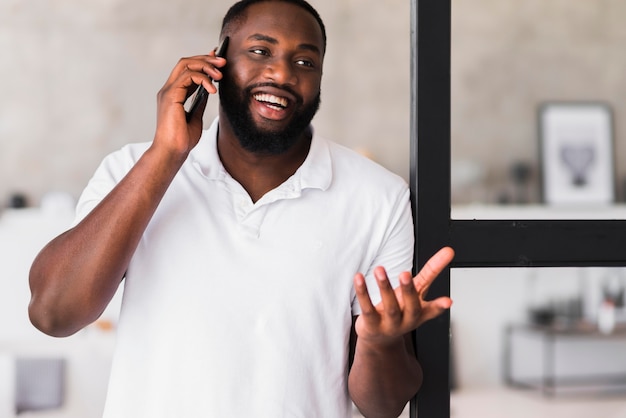 Handsome adult male talking on the phone