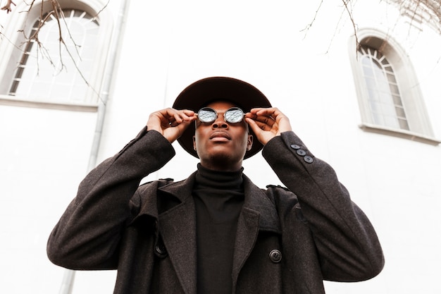 Handsome adult male with sunglasses and hat