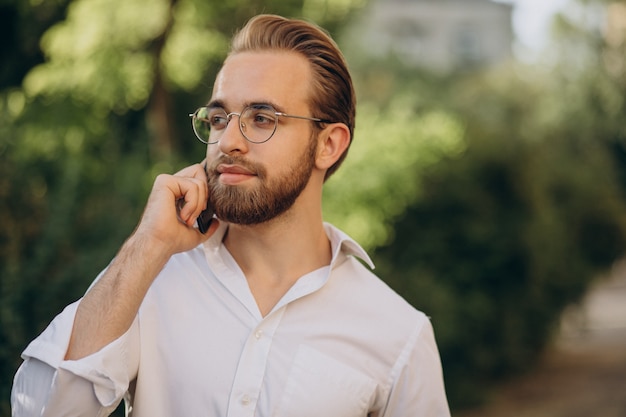 Handsome bearded man talking on the phone