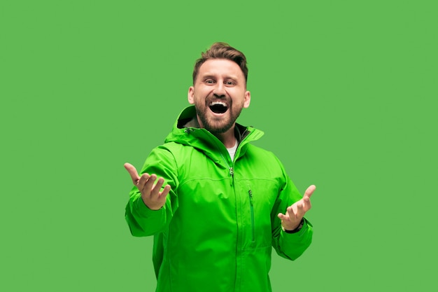 Free Photo handsome bearded young man isolated on green