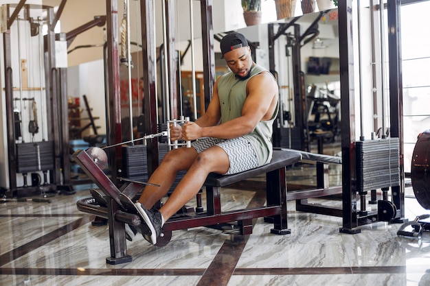 A handsome black man is engaged in a gym