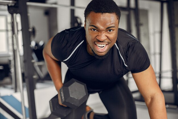 A handsome black man is engaged in a gym