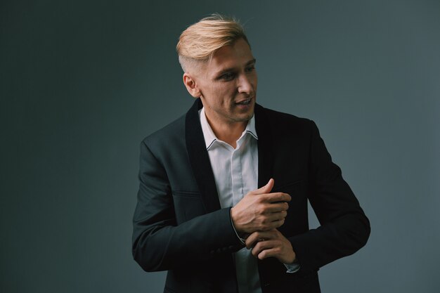 Handsome blond young man posing at studio