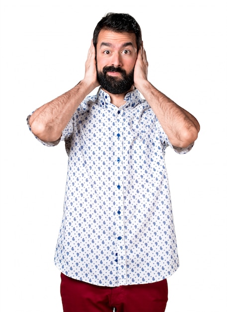 Handsome brunette man with beard covering his ears