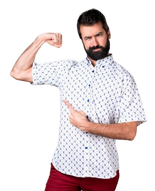 Free Photo handsome brunette man with beard making strong gesture