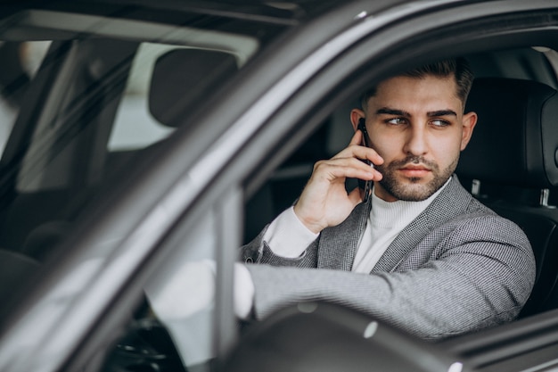 Free Photo handsome business man driving in car