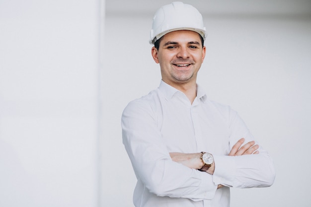 Handsome business man engineer in hard hat in a building