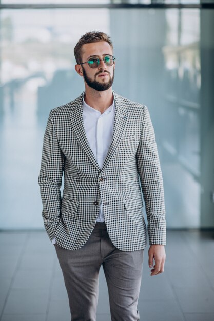 Handsome business man standing in office