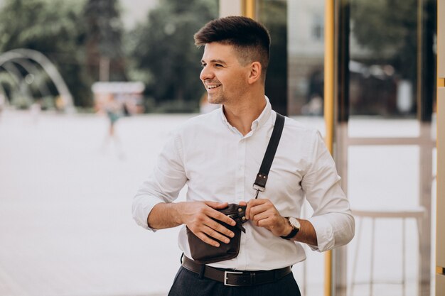 Handsome business man in white shirt outside