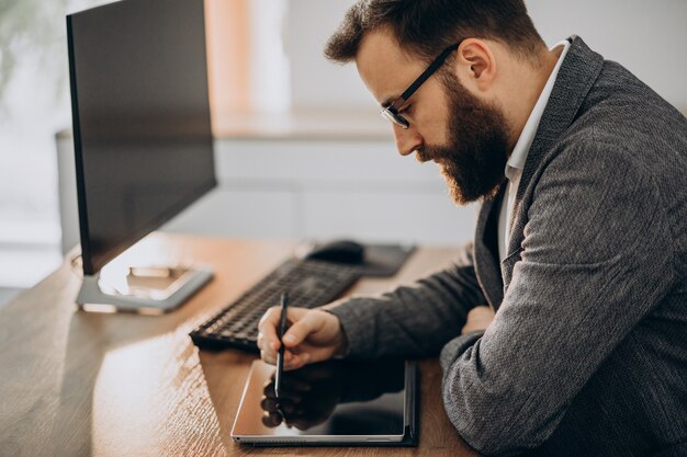 Handsome business man working at the desk