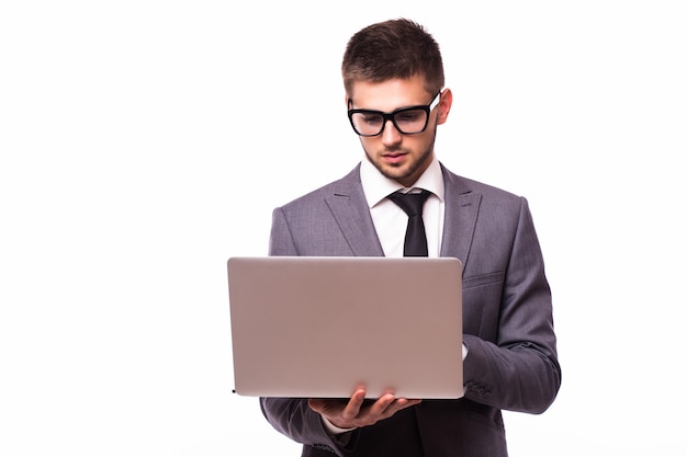 Handsome businessman with laptop isolated on white background