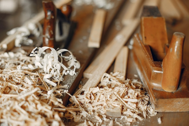 Free photo handsome carpenter working with a wood