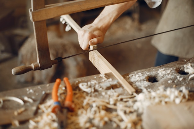 Free photo handsome carpenter working with a wood