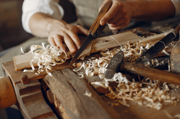 Free Photo handsome carpenter working with a wood