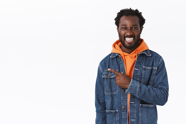 Handsome cheerful african-american male in denim jacket