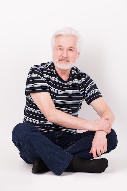 Handsome elderly man sitting