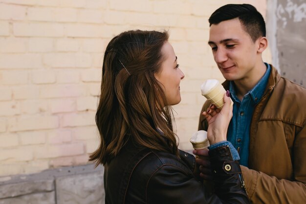 Handsome guy and pretty woman with ice cream