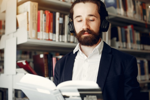 Free photo handsome guy study at the library