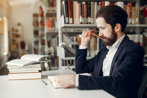 Free photo handsome guy study at the library