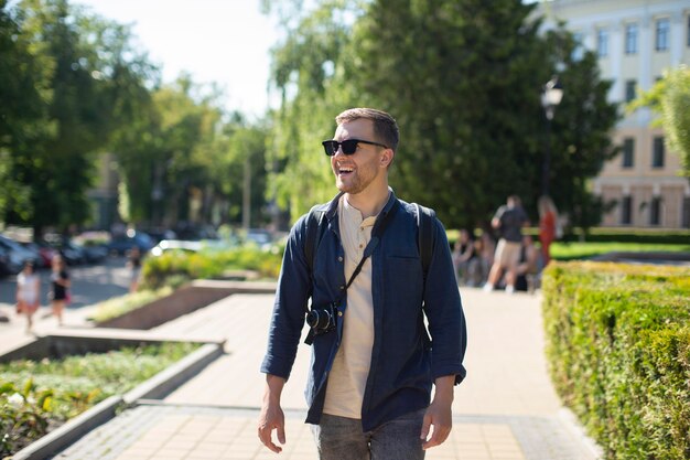 Handsome male traveler in a local outdoor place