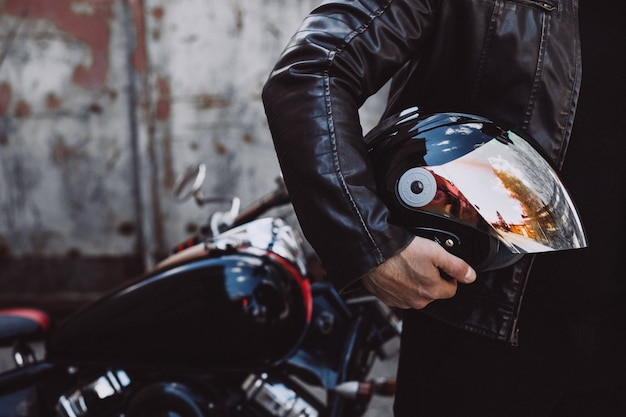 Handsome man biker travelling on mototrcycle