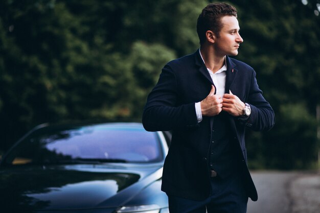 Handsome man by car