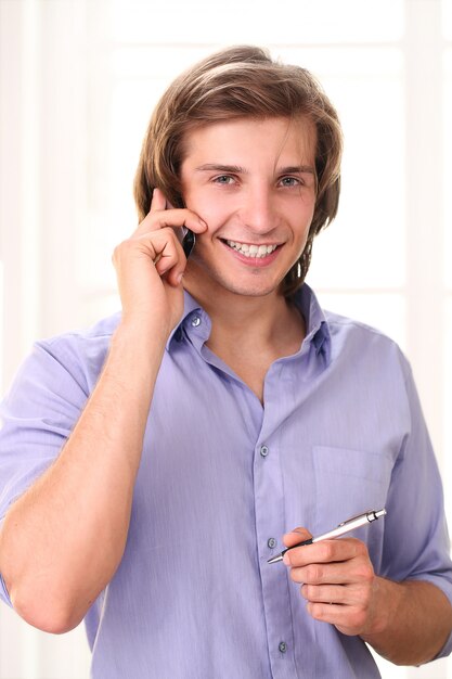 Handsome man calling by cell phone