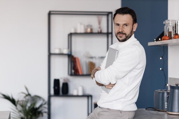 handsome man in casual wear at home