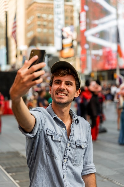 Free Photo handsome man in city taking selfie